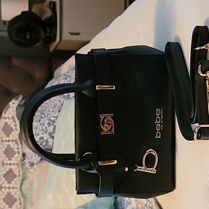 Brand new black small satchel, with shoulder strap